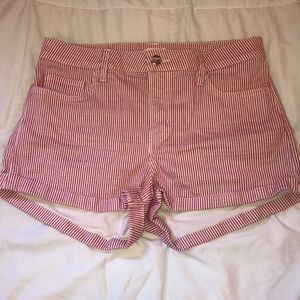 Red striped, high waisted shorts.